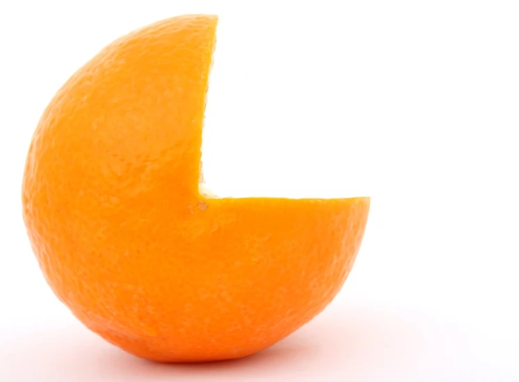 a whole orange in front of white background