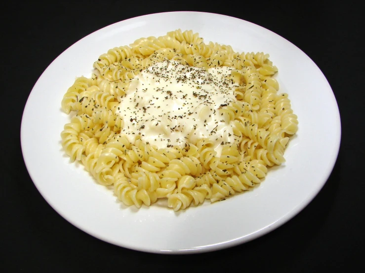 a white plate filled with food and a fork