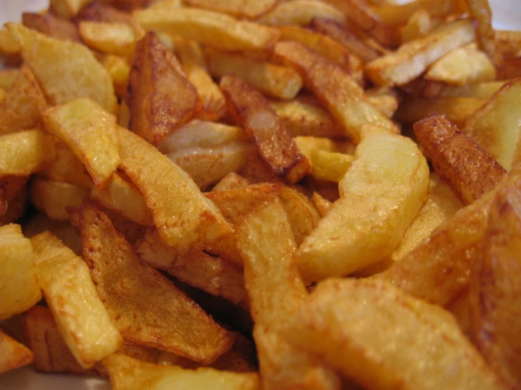 some french fries are laying on the table