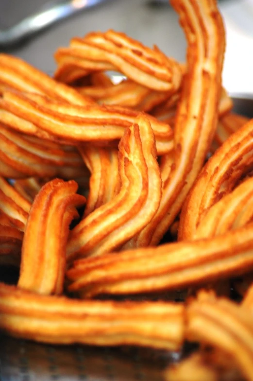 close up of some churros that have been fried