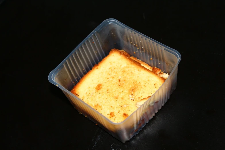 a rectangular baking dish with a creme on top