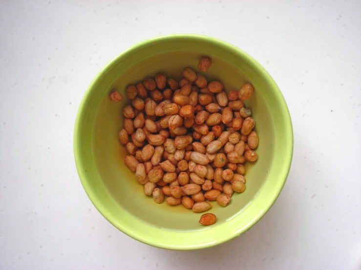 there is a bowl with a small amount of beans inside it