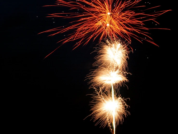 a firework display on the beach at night