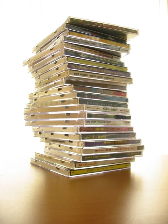 a stack of cassette disks sit on a table