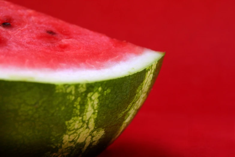 a sliced of watermelon sits in a bowl