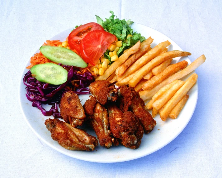 an assortment of food with fries on a plate