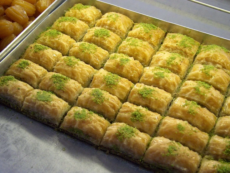 an assortment of pastries being cooked on a table