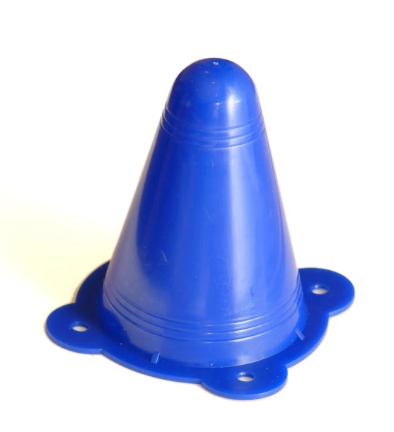 a small blue plastic cone sits in the corner