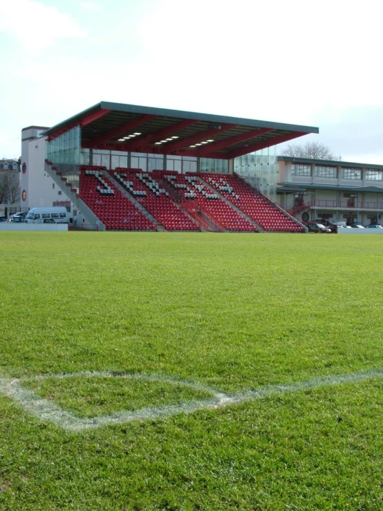 the sports stadium with the grass turf is empty