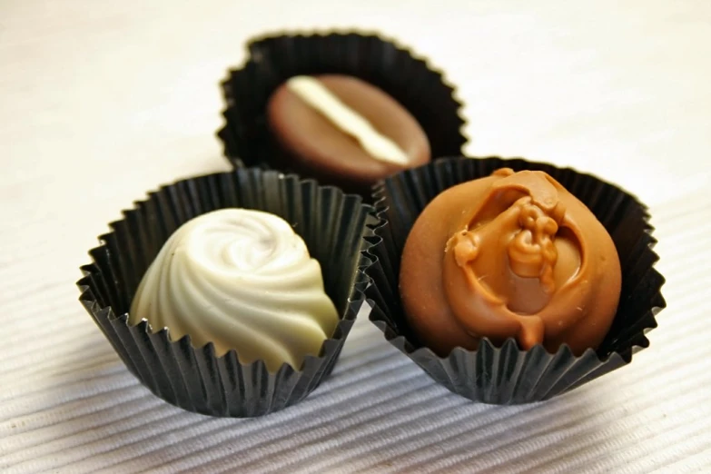 the four chocolates are in the small cups