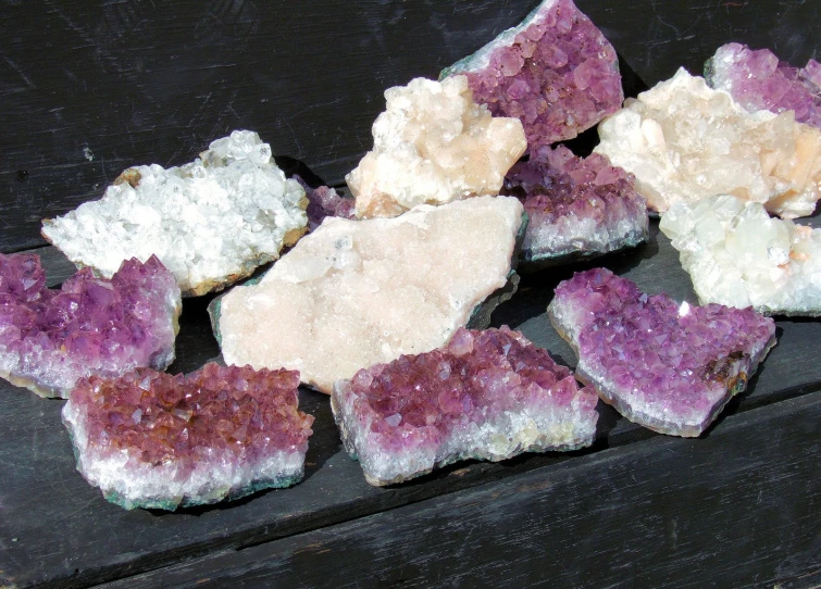 the rocks have pink and purple crystals on them