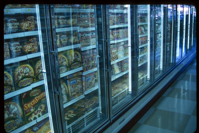 rows of display cases with snacks sitting on shelves