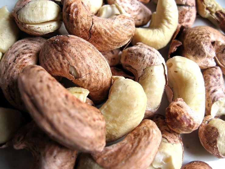 nuts and cashews are shown together for a healthy snack