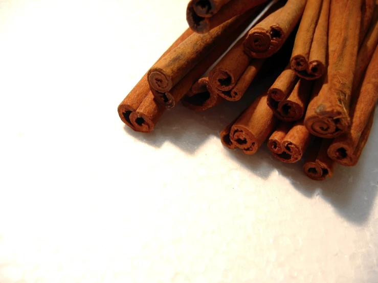 a pile of cinnamon sticks sitting on top of a table