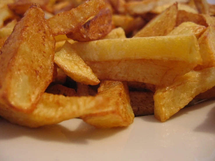 a plate with some fried potato wedges on it