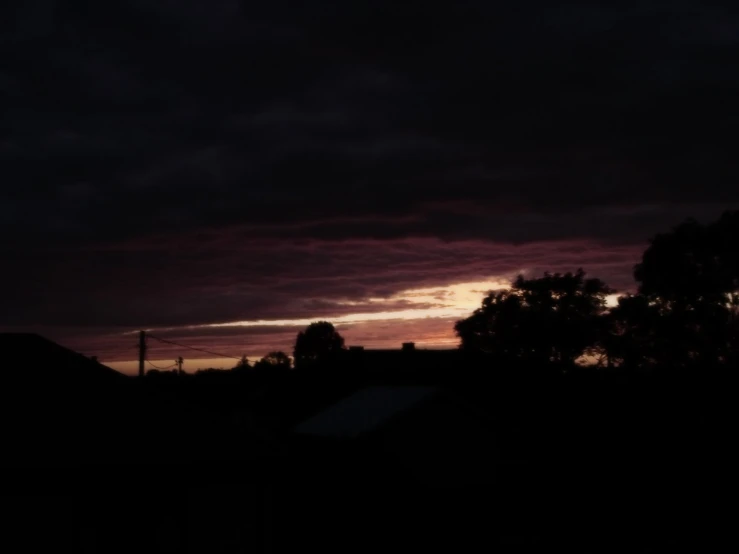 the sunset is shown over a residential neighborhood