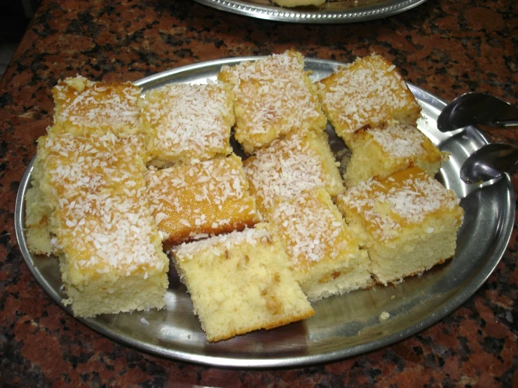 many slices of dessert in a silver serving platter