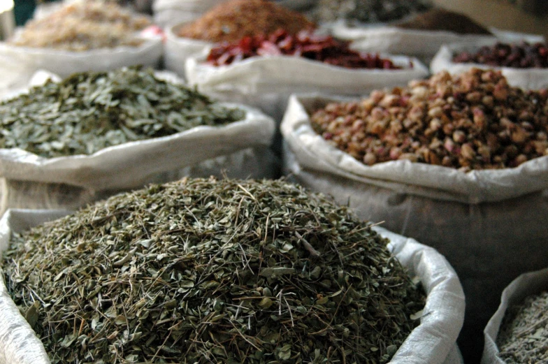 piles of spices next to each other on bags