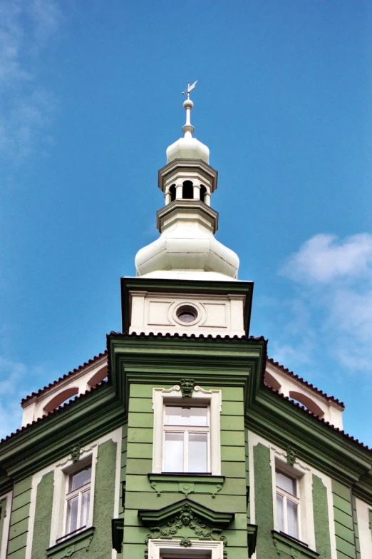 a building with an ornate steeple on top of it