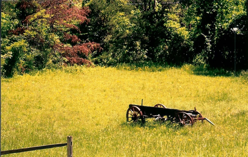 an old tractor abandoned in a grassy field