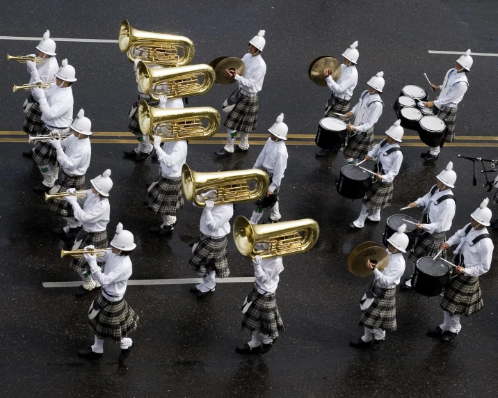 a parade of ss trumpets playing in street procession