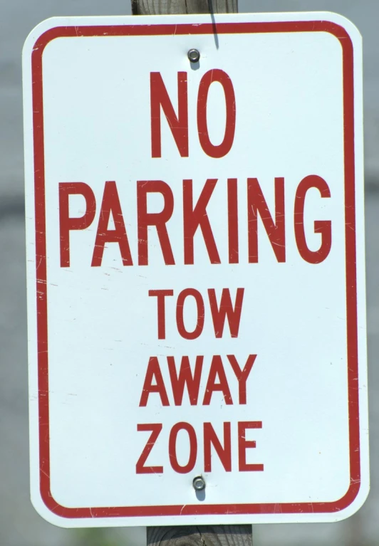 a sign for parking no parking tow away zone