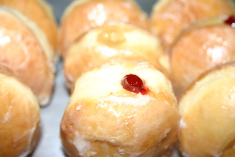 doughnuts with jam are stacked together in the middle