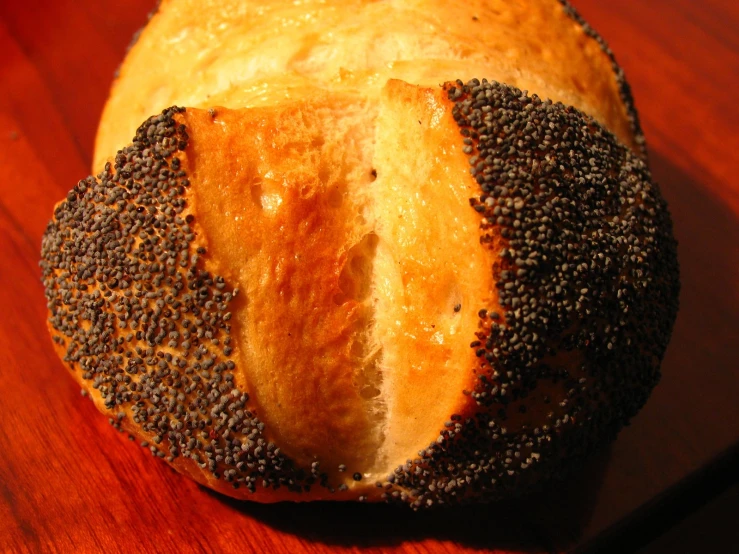 a loaf of bread that has been sprinkled with black seeds