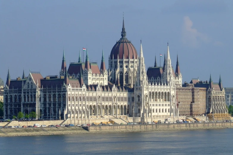 a large building near the water in a city