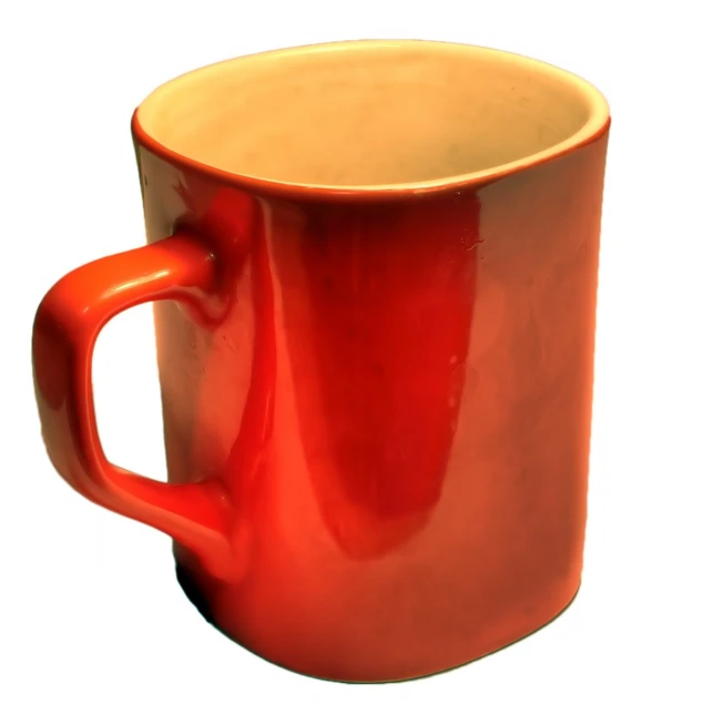 a coffee cup with a red handle on a white background