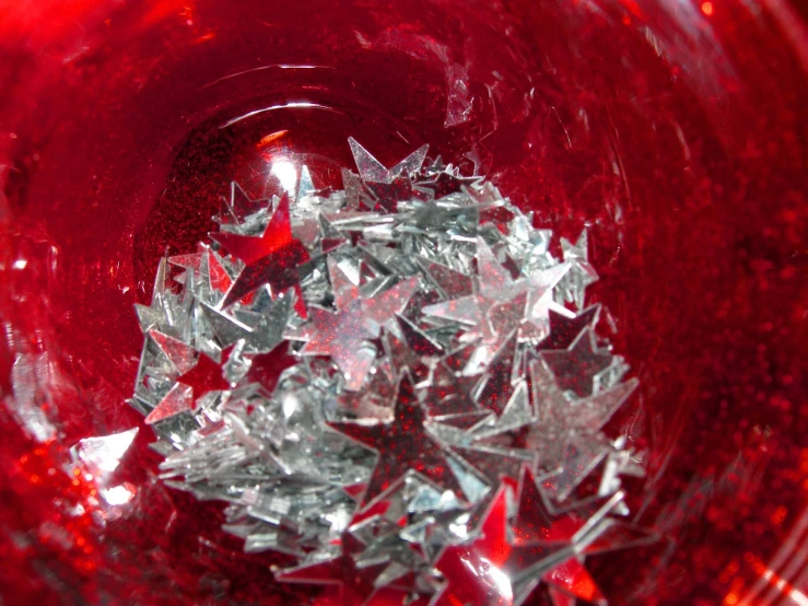 red glass plate with star cut stars in it