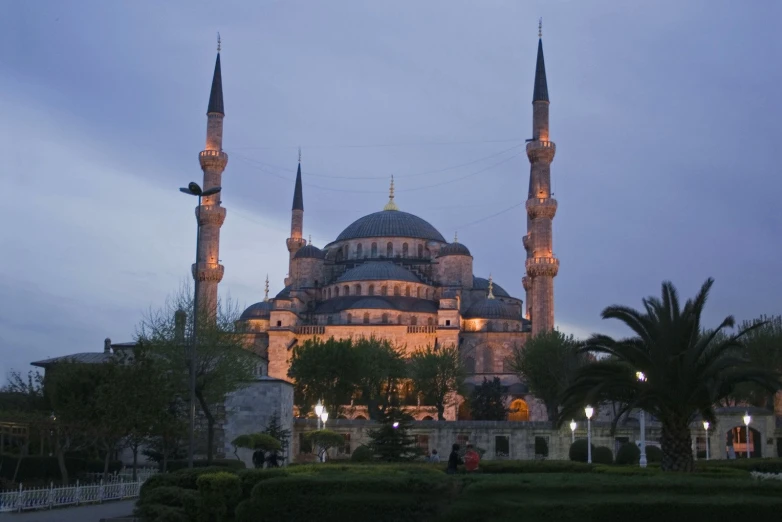 a large building with two towers at night