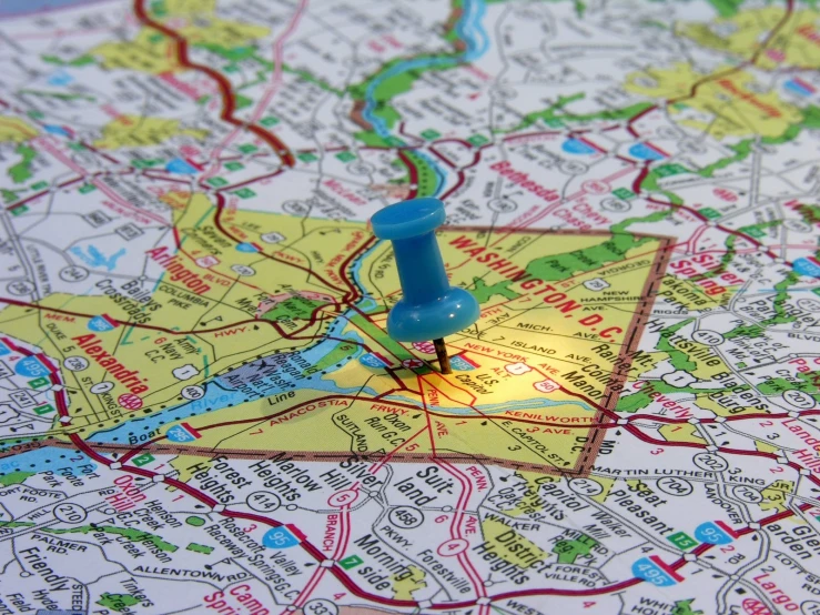 a pin on a map pointing to the town of london