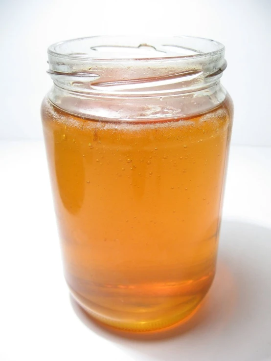 there is a jar of beer on the table