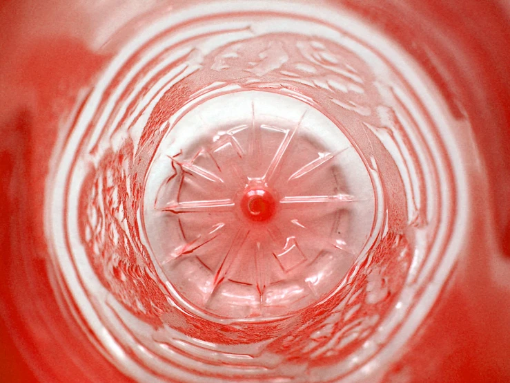 red glass on top of a shiny red object