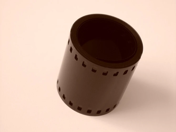 a cup is on a table top with white background