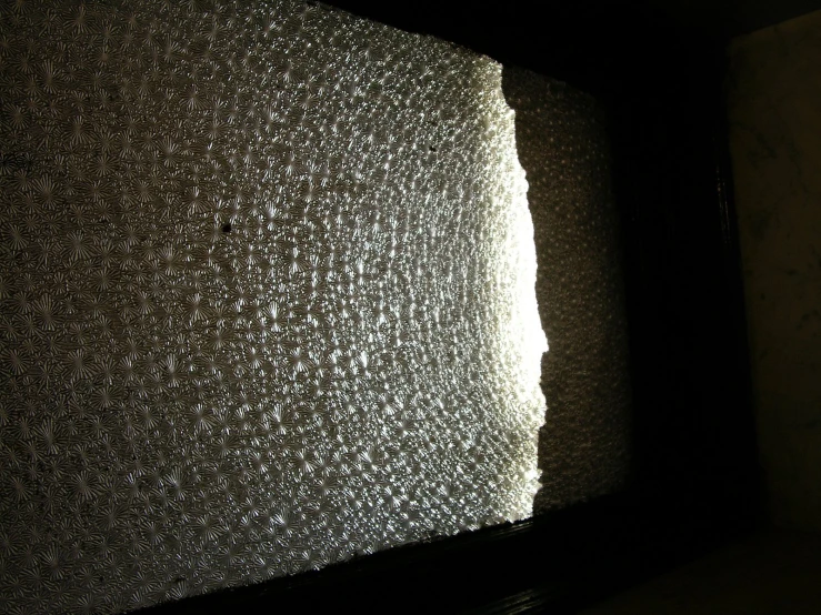 an image of close up of a wall made of metal mesh