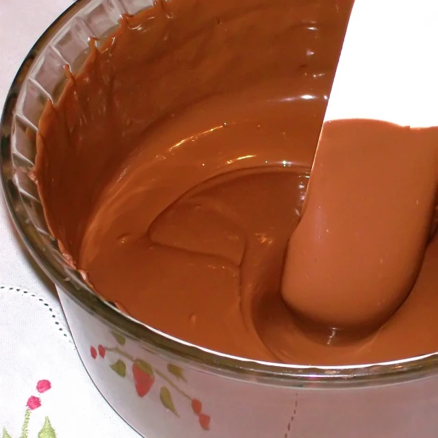 the chocolate has been melted in the pan with a spatula