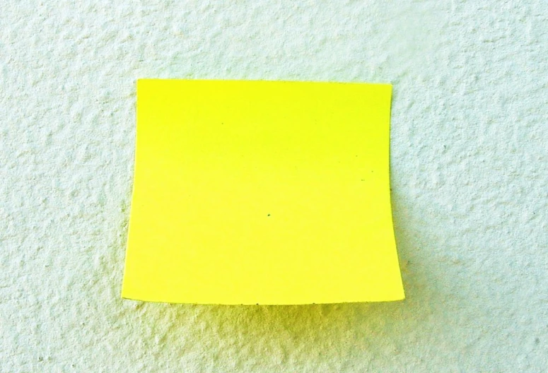 a yellow post - it with a hole for soing to put on