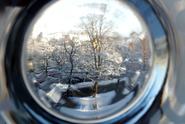 a view looking through a lens at a snowy area