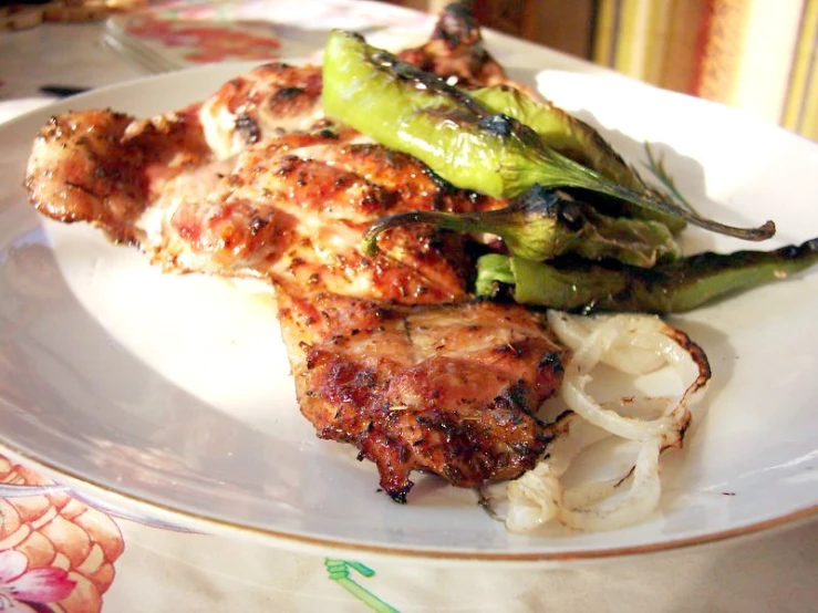 the chicken and asparagus are cooked on a plate