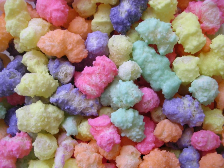 a pile of small colored popcorn with sprinkles