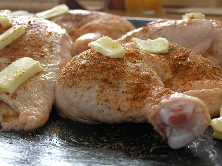 some chicken with potatoes on a table