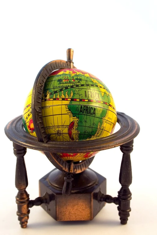 a wooden stand with a globe on it