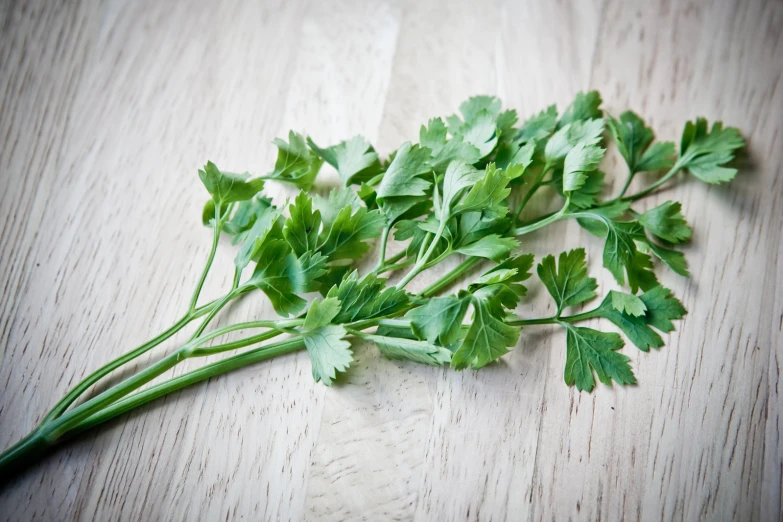 some tiny green vegetables are sitting on the wooden table