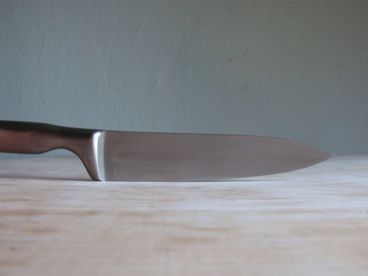 a knife sitting on top of a  board