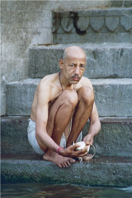 a man with  holding a white object