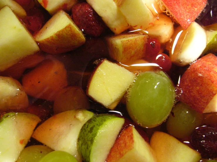 a close up of apples and gs with syrup