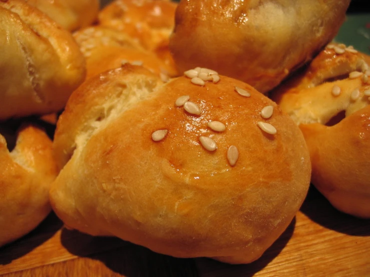 close up of bread rolls topped with sunflower seeds
