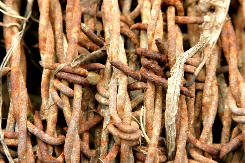 an old chain with rusted chains and ropes